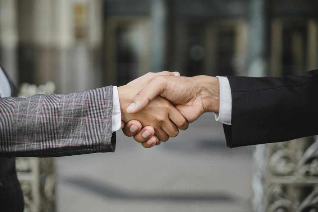 Two People Shaking Hands 